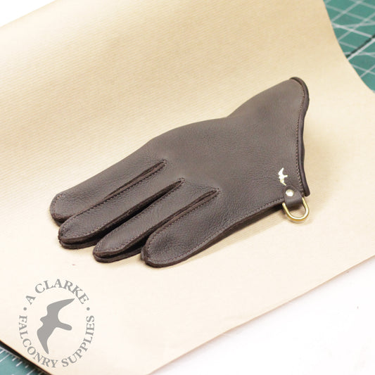 A wrist-length Falconry glove...
